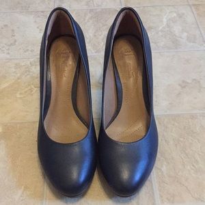 Black leather heels by Clark